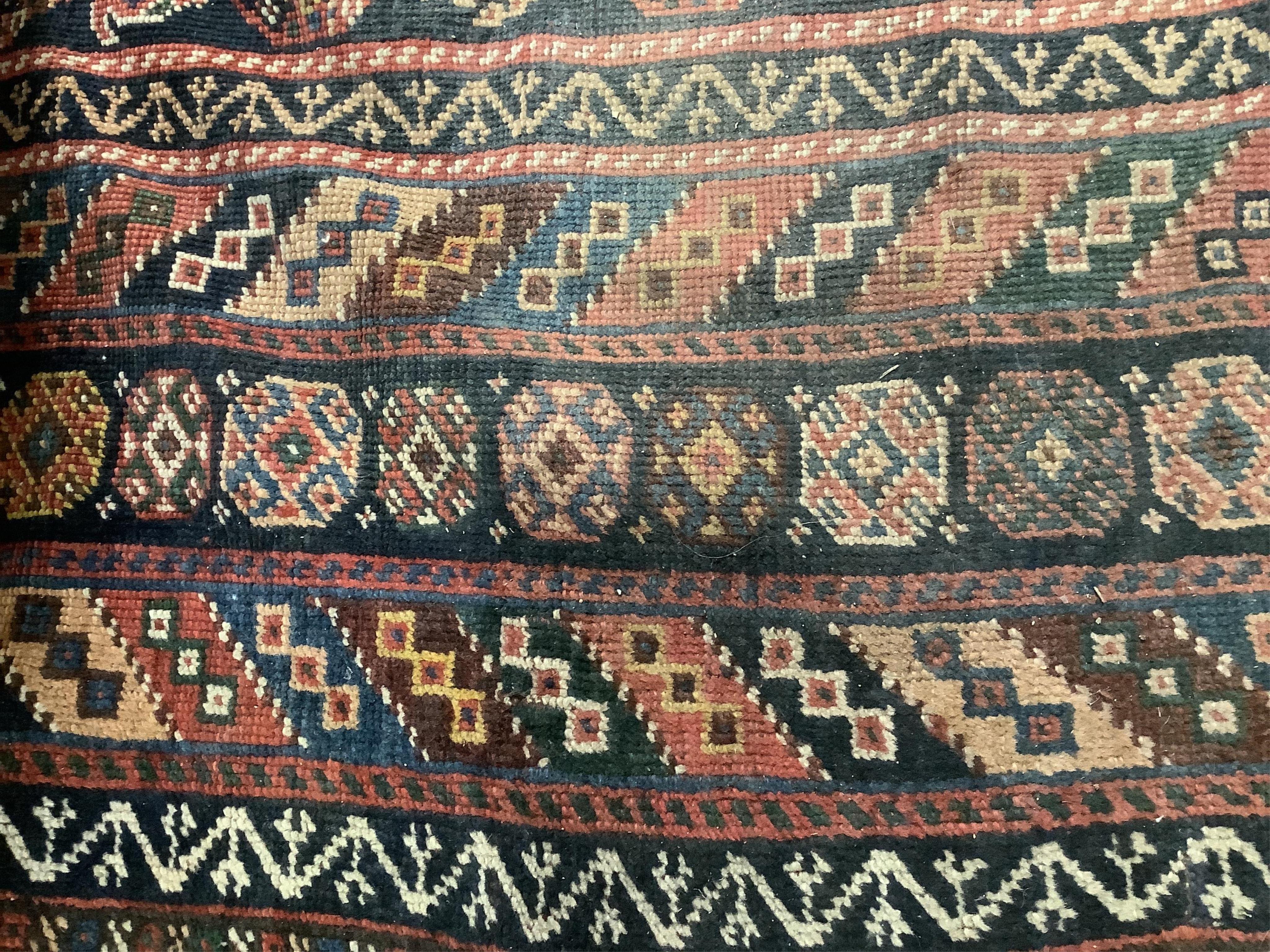 An antique Shirvan blue ground Boteh carpet, 290 x 170cm. Condition - fair